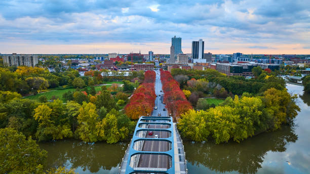 istock Aerial Autumn Cityscape with Tree-Lined Boulevard and Skyline 2162389473