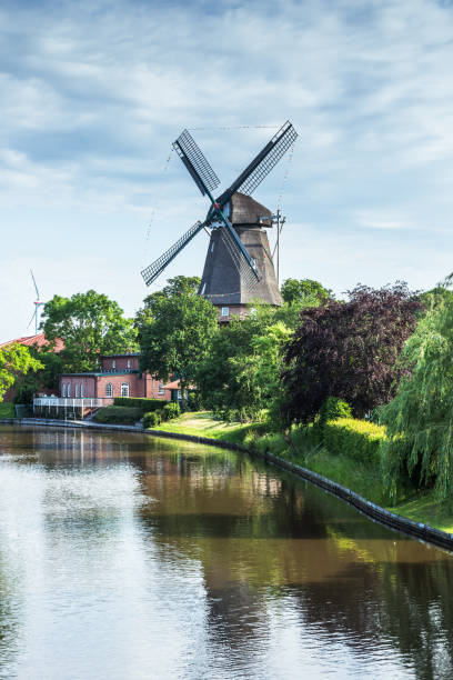 Windmill in Hinte, view at Knockster Tief, Galeriehollaender, Hinte, East Frisia, Lower Saxony, Germany