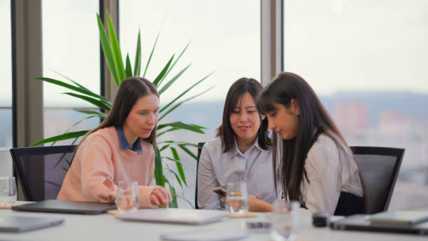 istock Three businesswomen taking a break and enjoying talking with each other 2162390119