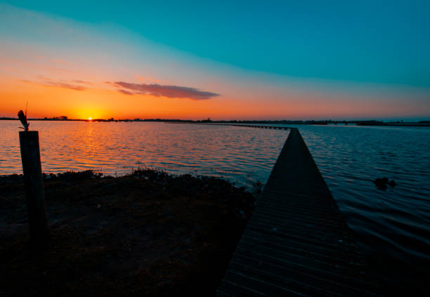 istock Multi color sunset over the water 2162390788