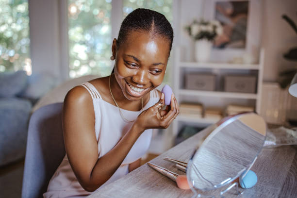 istock Black teen applying her makeup for prom night. 2162392986
