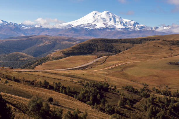 istock Winding road to a big mountain 2162393383