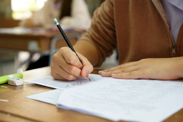 istock Thai students take a knowledge test to assess knowledge skills. The result of the exam will come out as a score value. Allows us to analyze the results or grade. Soft and selective focus. 2162398869