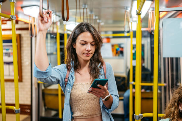 istock Young Woman Using A Phone While Riding In A Subway Train In Budapest In Hungary 2162400112