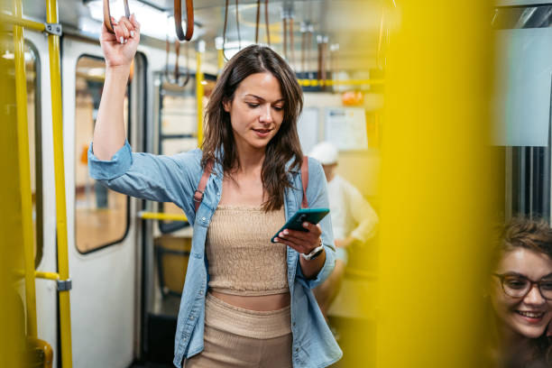 istock Young Woman Using A Phone While Riding In A Subway Train In Budapest In Hungary 2162400153