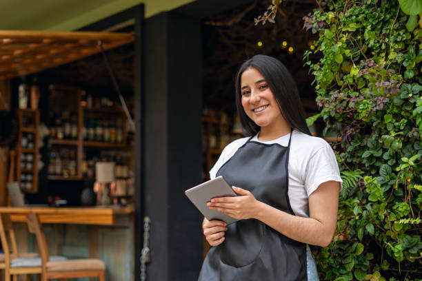 istock Happy waitress working in a restaurant. 2162406319