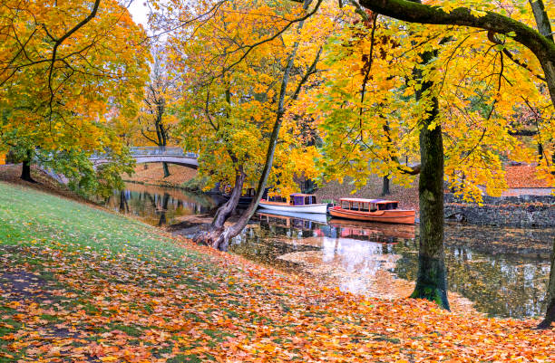 Autumn in central public park of Riga - the capital and largest city of Latvia, a major commercial, cultural, historical and tourist center of the Baltic region