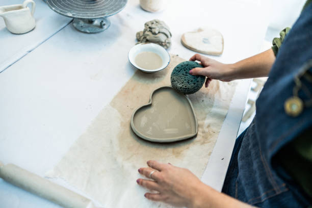istock Woman modeling clay at ceramics workshop 2162407754