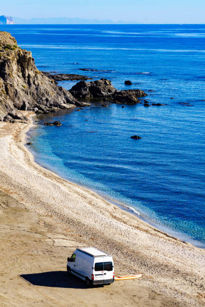 istock Caravan van on beach. View from above 2162408223