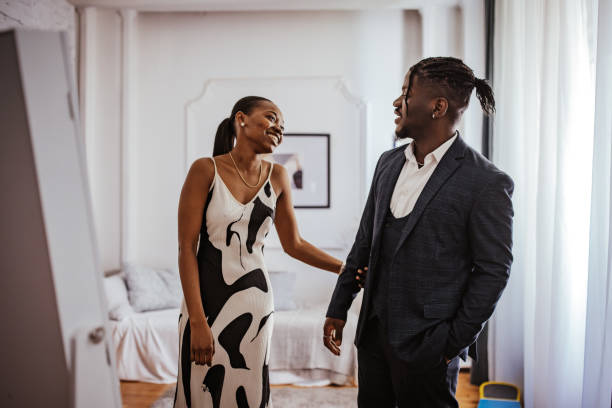 istock Sibling moment: sister helping brother with prom attire. 2162408854