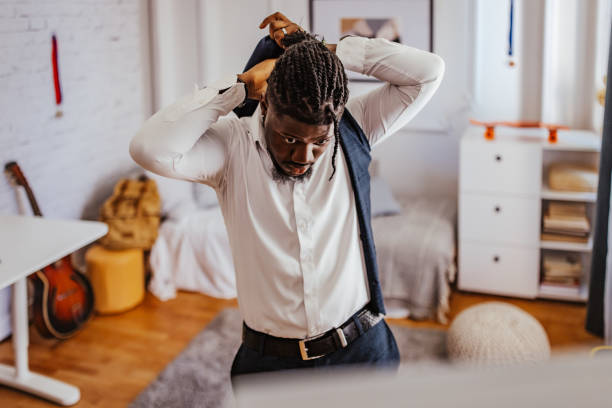 istock Teenage boy getting ready for prom night, checking appearance in mirror 2162410528