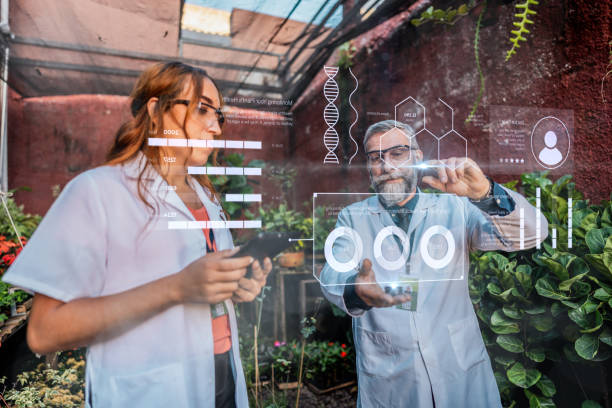 istock Coworkers analyzing data in the greenhouse 2162411044