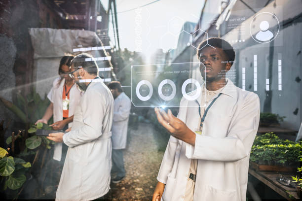 istock Young botanical man analyzing data in the greenhouse 2162411077