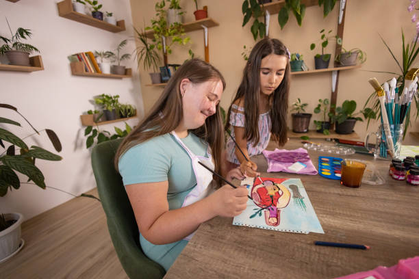 istock Sisters Painting Together 2162411089