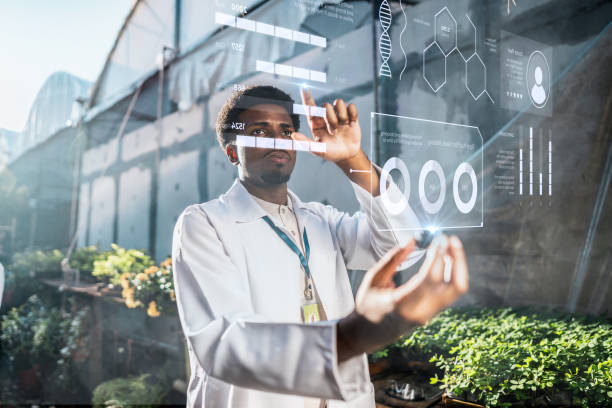 istock Young botanical man analyzing data in the greenhouse 2162411091