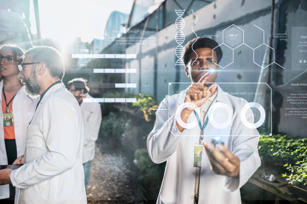 istock Young botanical man analyzing data in the greenhouse 2162411101