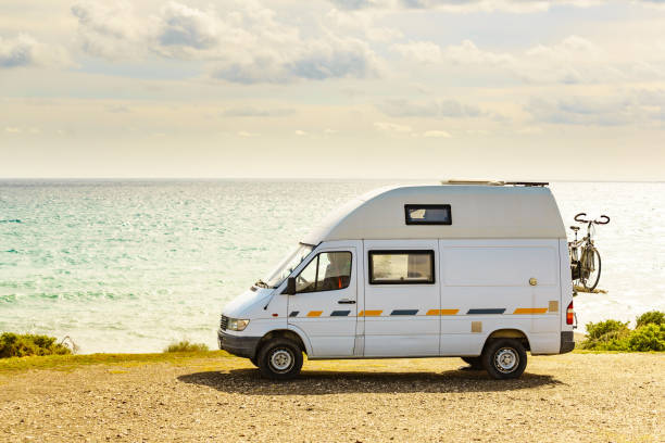 istock Caravan van camping on sea shore 2162413326