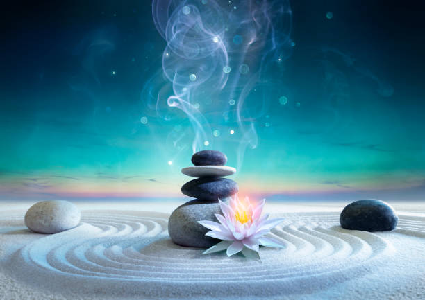 istock Yin And Yang Energy between Sky and Earth - Zen Concept - Stack Massage Stones On Raked Sand With Lotus And Abstract Smoke 2162417084