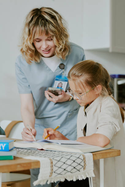 istock Mother Helping Daughter with Homework 2162418955