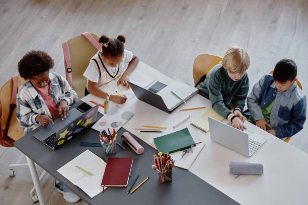 Top View of Children Studying Together at Table