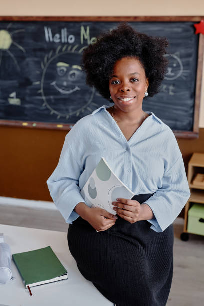 istock Happy Ethnic Woman Holding Notebook at School 2162419576