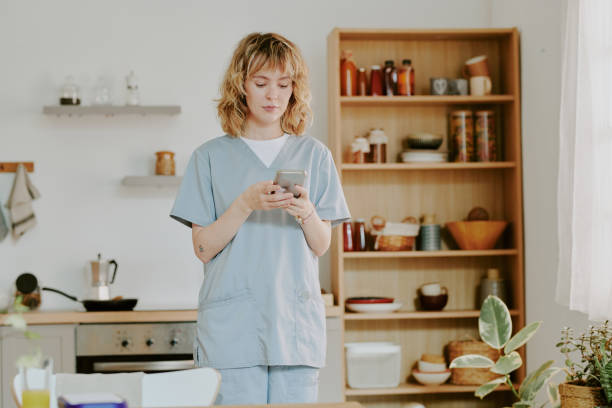 istock Nurse Having Breakfast at Home 2162421683