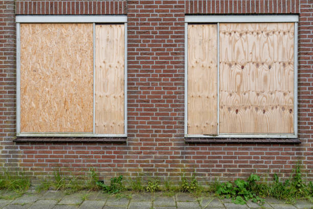 istock windows of a building protected with wooden panels 2162423471
