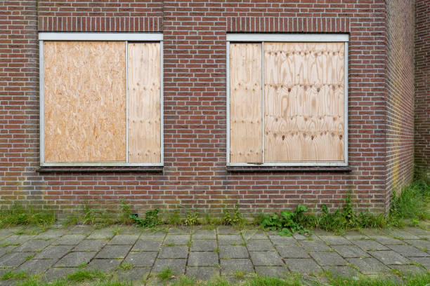 istock windows of a building protected with wooden panels 2162423754