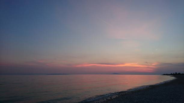 istock Pink sunset on the beach 2162423824