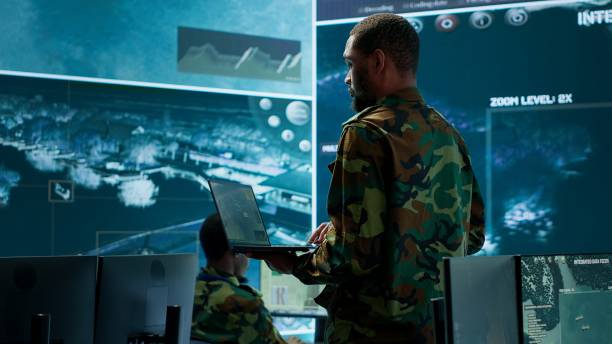 istock Team of military specialists operate in a secret service command post 2162424984