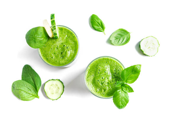 istock Detox green smoothie in glasses and ingredients 2162425209