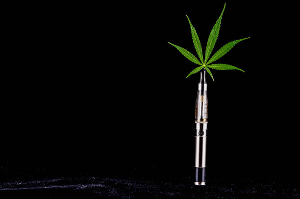 istock A marijuana plant is sitting on top of a vape 2162425603