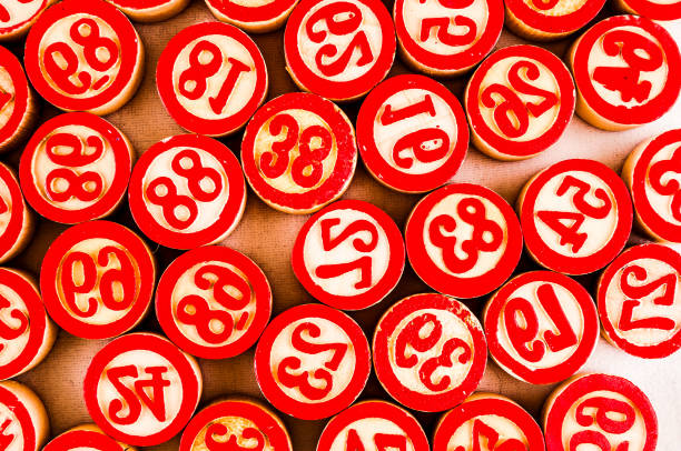A bunch of red numbered balls. The numbers range from 1 to 39. The balls are arranged in a pattern, with some overlapping and others not. Scene is playful and fun, as the balls are colorful