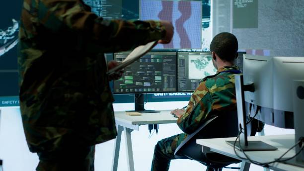 istock Skilled team of military specialists operate advanced technology and big screen 2162426491
