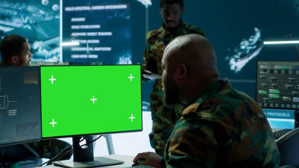 istock Soldier analyzing real time data next to green screen in high tech office 2162427060