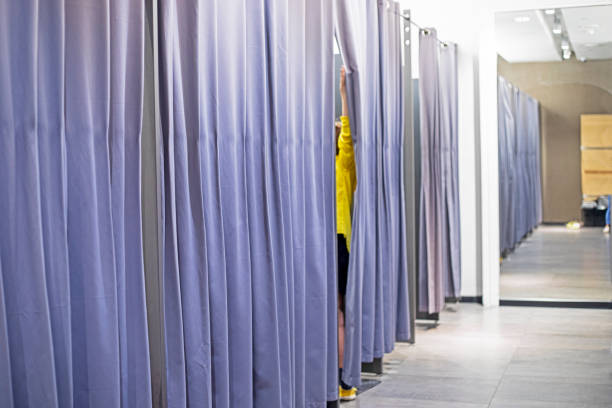 istock modern fitting room with gray curtains in a clothing store. 2162427490
