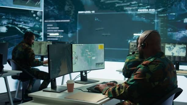 istock Military personnel in base of operations using advanced computers and big screen 2162427671
