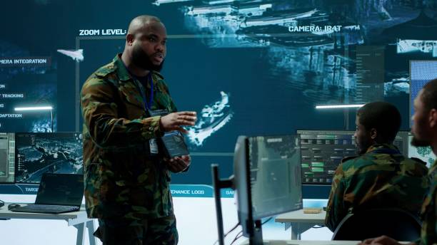 istock Military officer leads cybersecurity efforts in a high tech control center 2162427681