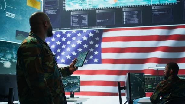 istock Angry army expert in a command post power base monitors satellite footage 2162427725