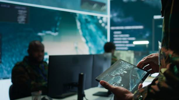 istock Military officer leads cybersecurity operations in a high tech operation room 2162427863