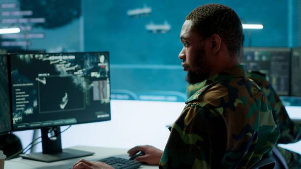istock Team of military specialists oversee surveillance activity by using cctv footage 2162428006