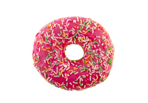 Pink Donut with sprinkles on blue ceramic plate isolated on white background, side view, close up, minimalism