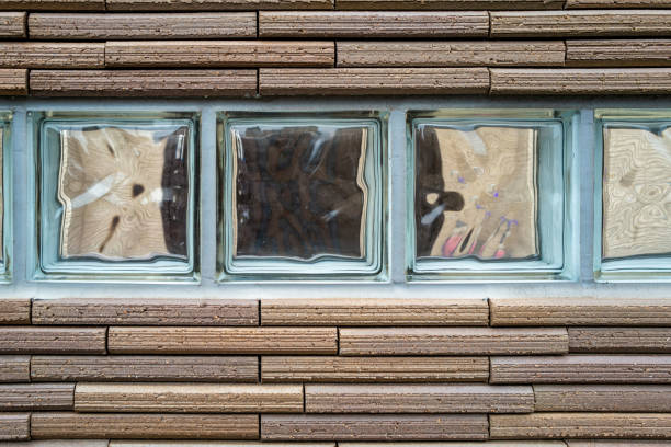 Wall with elongated bricks and designed glass windows