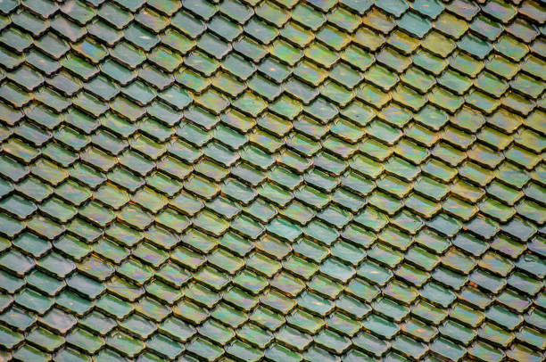 A green roof with a pattern of squares. The roof is made of tiles and has a unique design