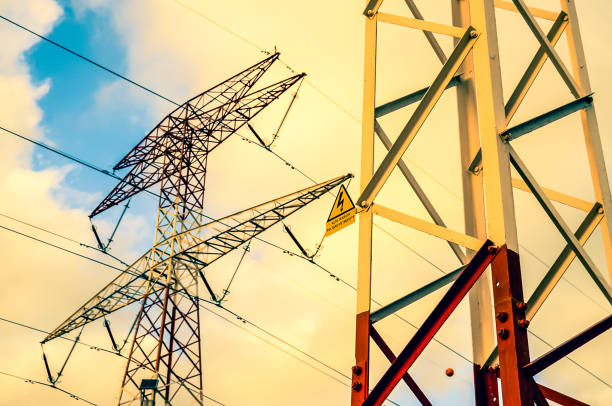 istock A tall power pole with a yellow sign on it 2162431829