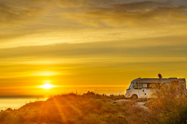 istock Caravan on sea at sunrise. 2162433277