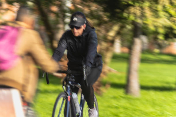 Bogota Colombia 20 de junio de 2024: Woman cyclist in blurred motion on cycle path