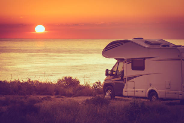 istock Caravan on sea at sunrise. 2162433333