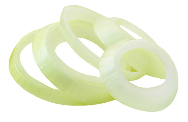 istock Falling onion rings isolated on white background.  Levitating onion pieces, macro. Flyinf onions 2162433621