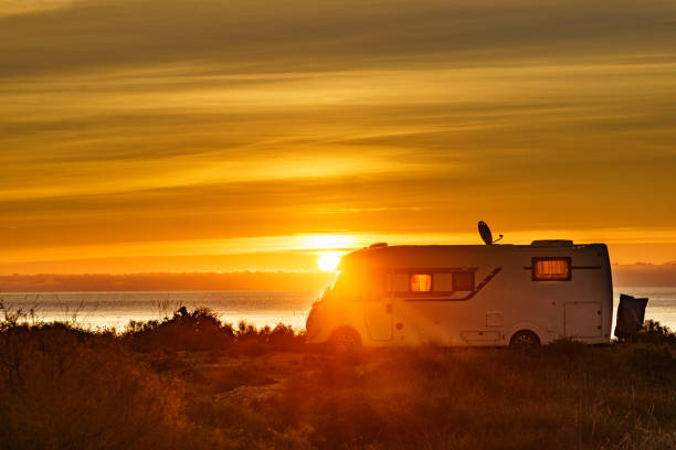 istock Caravan on sea at sunrise. 2162434023